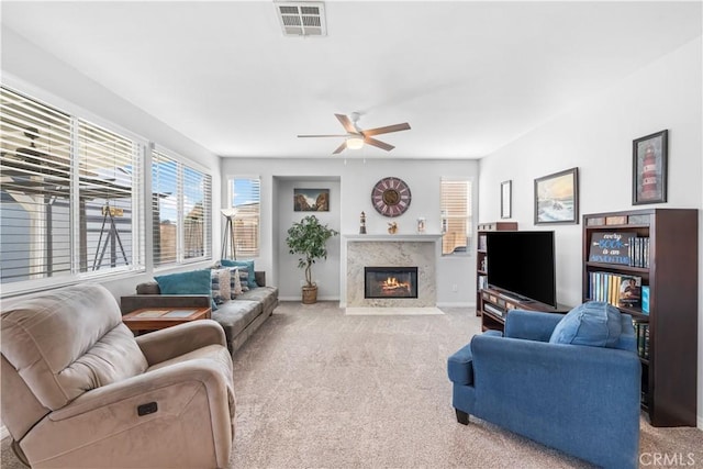 4604 Trojan Ct, Lancaster, CA 93536 - carpeted living room with a ceiling fan and a high end fireplace