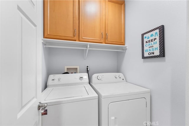 4604 Trojan Ct, Lancaster, CA 93536 - laundry room with cabinet space and washing machine and clothes dryer