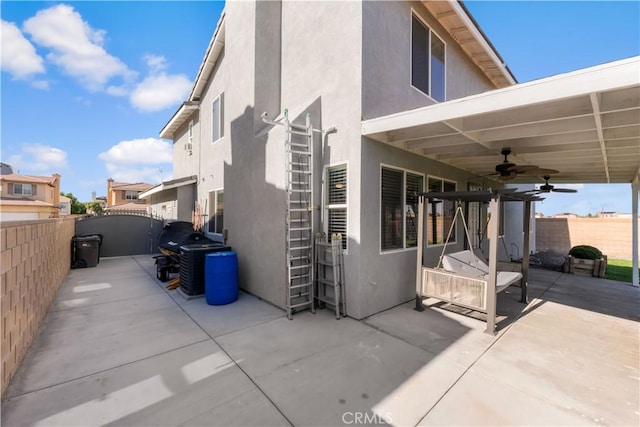 4604 Trojan Ct, Lancaster, CA 93536 - view of patio / terrace featuring ceiling fan and a gate