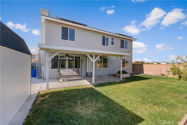 4604 Trojan Ct, Lancaster, CA 93536 - rear view of property with stucco siding, a fenced backyard, ceiling fan, and a patio area