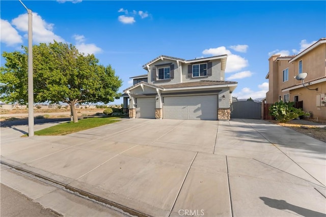 4604 Trojan Ct, Lancaster, CA 93536 - view of front of home with an attached garage, a gate, concrete driveway, and stone siding