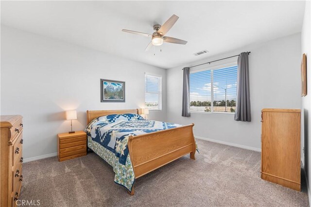 4604 Trojan Ct, Lancaster, CA 93536 - carpeted bedroom with baseboards and ceiling fan