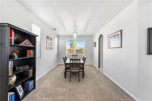 4604 Trojan Ct, Lancaster, CA 93536 - carpeted dining room with arched walkways and baseboards