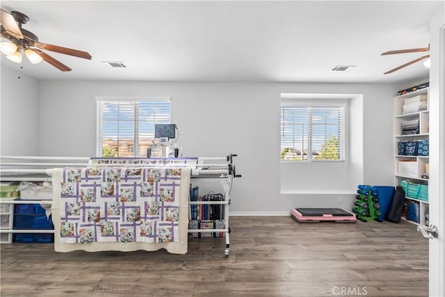 4604 Trojan Ct, Lancaster, CA 93536 - bedroom featuring multiple windows, wood finished floors, and a ceiling fan