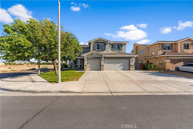 4604 Trojan Ct, Lancaster, CA 93536 - view of front of property featuring an attached garage, concrete driveway, stucco siding, and stone siding