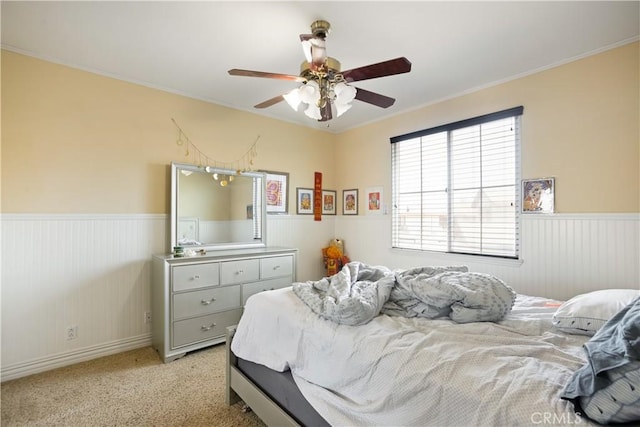 5156 Branding Iron Pl, Rancho Cucamonga, CA 91739 - bedroom featuring a wainscoted wall, ornamental molding, ceiling fan, and light carpet