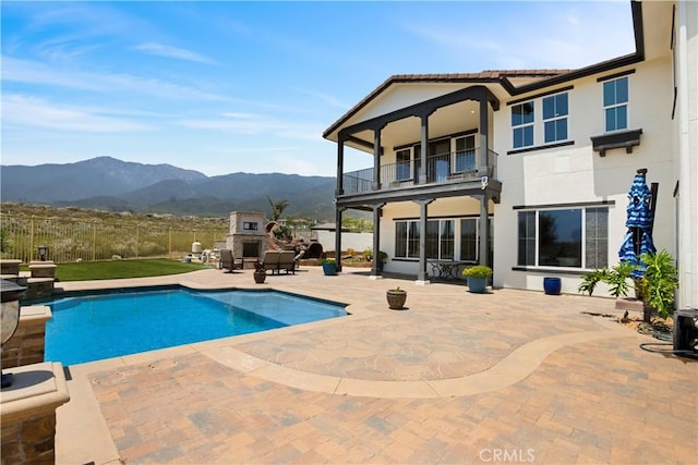 5156 Branding Iron Pl, Rancho Cucamonga, CA 91739 - view of pool with a mountain view, a fireplace, and a patio area