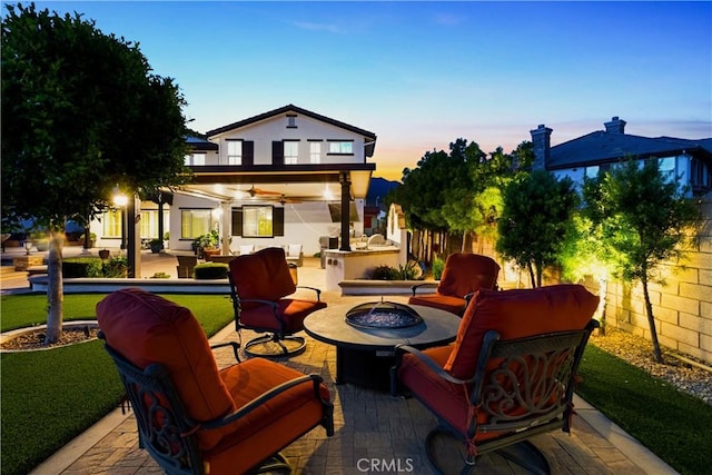 5156 Branding Iron Pl, Rancho Cucamonga, CA 91739 - fenced backyard with a patio area, an outdoor living space with a fire pit, and a ceiling fan