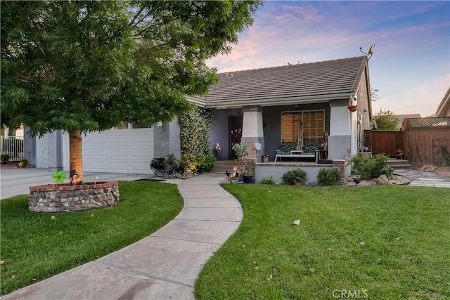12528 Sonora Way, Victorville, CA 92392 - view of front of home featuring stucco siding, a tiled roof, driveway, and an attached garage