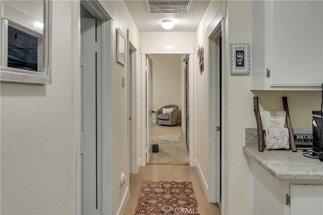 12528 Sonora Way, Victorville, CA 92392 - hallway with light wood-style flooring