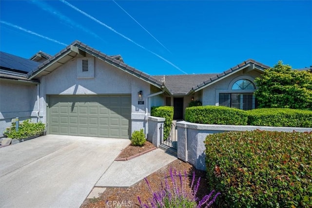 247 Oakwood Ct, Arroyo Grande, CA 93420 - single story home featuring a garage, stucco siding, a gate, a tiled roof, and driveway