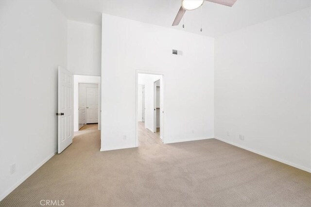 247 Oakwood Ct, Arroyo Grande, CA 93420 - spare room featuring light carpet, ceiling fan, and a high ceiling