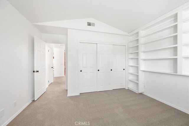 247 Oakwood Ct, Arroyo Grande, CA 93420 - unfurnished bedroom with carpet, lofted ceiling, and a closet