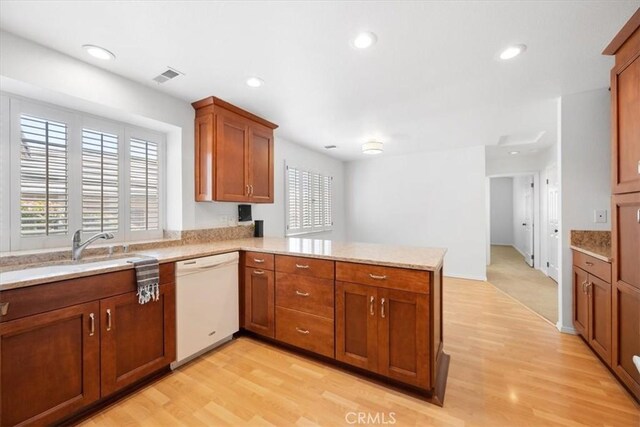 247 Oakwood Ct, Arroyo Grande, CA 93420 - kitchen featuring white dishwasher, a peninsula, light wood-type flooring, plenty of natural light, and recessed lighting