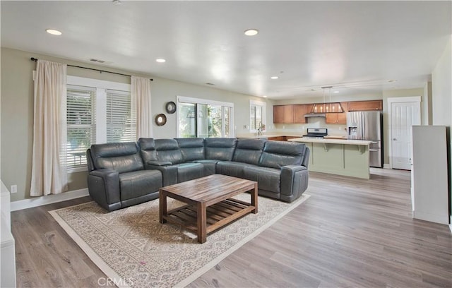 44255 Cajun St, Lancaster, CA 93535 - living room featuring recessed lighting and light wood finished floors
