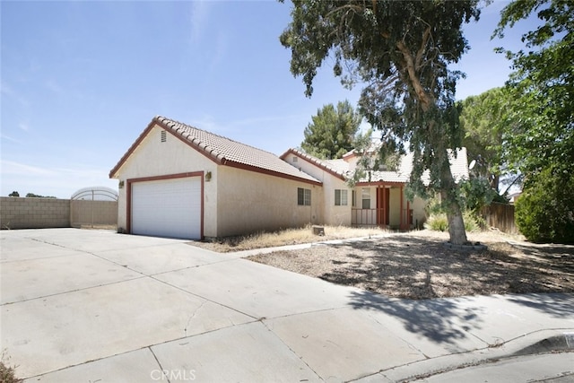44105 Acacia St, Lancaster, CA 93535 - view of side of property featuring a tiled roof, stucco siding, and driveway