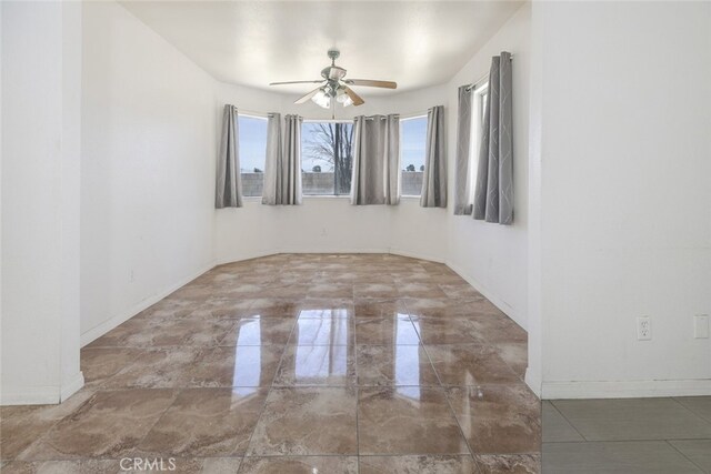 44105 Acacia St, Lancaster, CA 93535 - empty room featuring ceiling fan and marble tiled floors