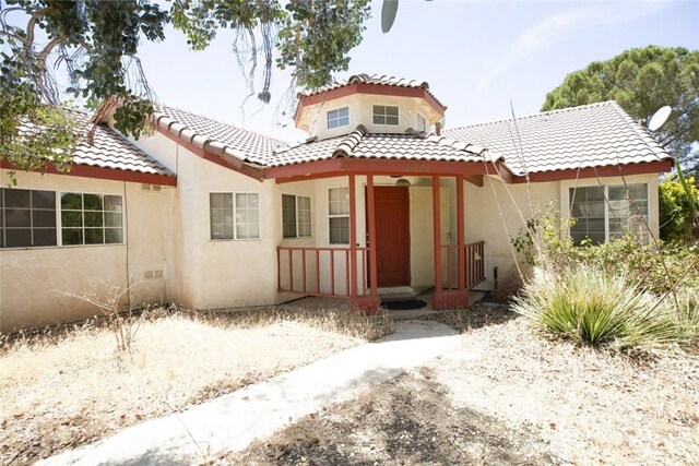 44105 Acacia St, Lancaster, CA 93535 - mediterranean / spanish-style house with covered porch, stucco siding, and a tile roof