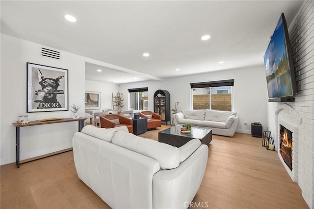 1041 S Falling Leaf Cir, Anaheim Hills, CA 92807 - living area featuring light wood finished floors, recessed lighting, and a fireplace