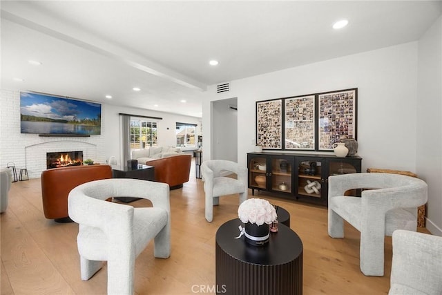 1041 S Falling Leaf Cir, Anaheim Hills, CA 92807 - living area featuring light wood-type flooring, a brick fireplace, and recessed lighting