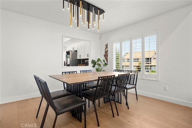 1041 S Falling Leaf Cir, Anaheim Hills, CA 92807 - dining area featuring light wood finished floors and baseboards
