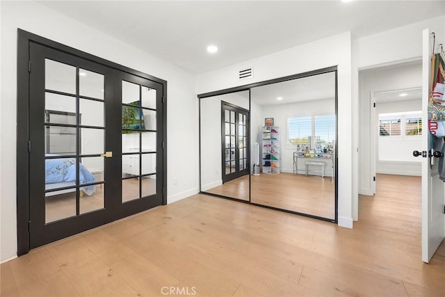 1041 S Falling Leaf Cir, Anaheim Hills, CA 92807 - empty room featuring french doors, wood finished floors, and recessed lighting