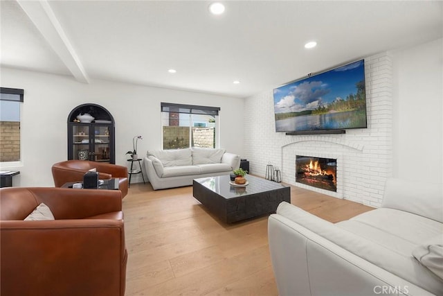 1041 S Falling Leaf Cir, Anaheim Hills, CA 92807 - living area featuring a brick fireplace, light wood-style floors, recessed lighting, and beamed ceiling
