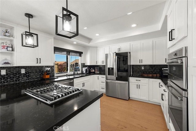 1041 S Falling Leaf Cir, Anaheim Hills, CA 92807 - kitchen featuring stainless steel appliances, light wood-style flooring, white cabinets, backsplash, and recessed lighting