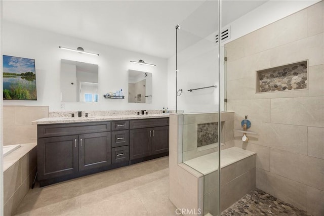 1041 S Falling Leaf Cir, Anaheim Hills, CA 92807 - bathroom featuring tiled shower, double vanity, tile patterned flooring, and a relaxing tiled tub