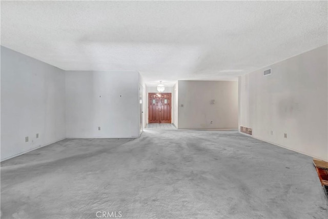 1510 E Newcrest Dr, West Covina, CA 91792 - unfurnished room featuring a textured ceiling, light carpet, and a chandelier