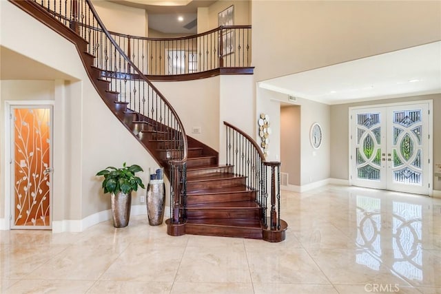 2155 Chandler Dr, Tustin, CA 92782 - foyer entrance featuring french doors, stairway, and a towering ceiling