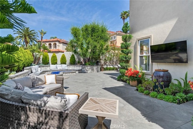 2155 Chandler Dr, Tustin, CA 92782 - view of patio with an outdoor living space with a fire pit