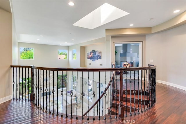 2155 Chandler Dr, Tustin, CA 92782 - corridor with hardwood / wood-style floors, a skylight, an upstairs landing, and recessed lighting