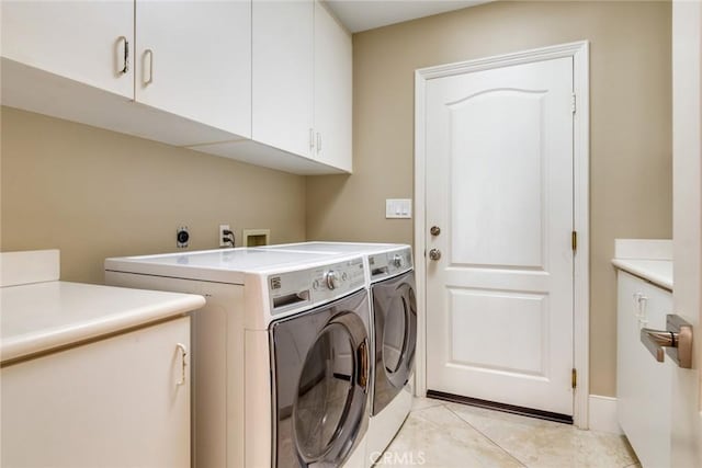 2155 Chandler Dr, Tustin, CA 92782 - laundry room with cabinet space, washer and dryer, and light tile patterned flooring