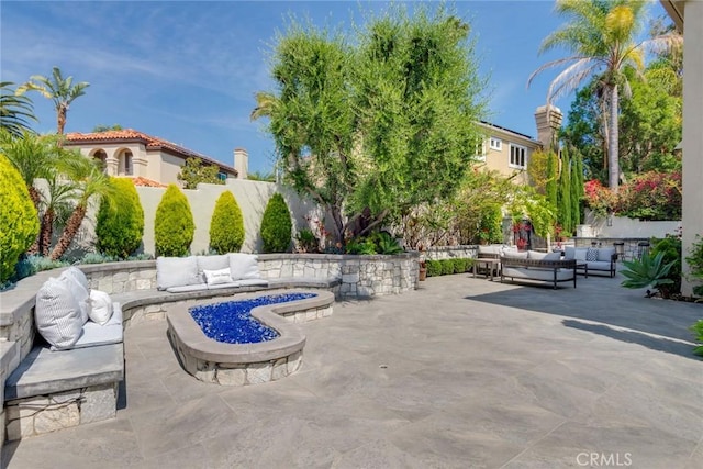 2155 Chandler Dr, Tustin, CA 92782 - fenced backyard with an outdoor living space with a fire pit and a patio