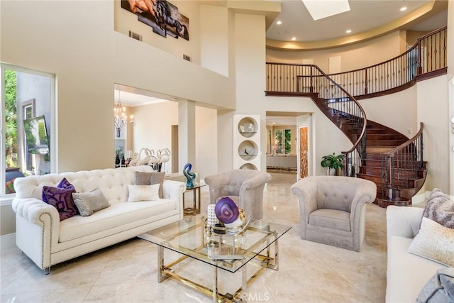 2155 Chandler Dr, Tustin, CA 92782 - living area featuring a high ceiling, stairs, a chandelier, recessed lighting, and a skylight