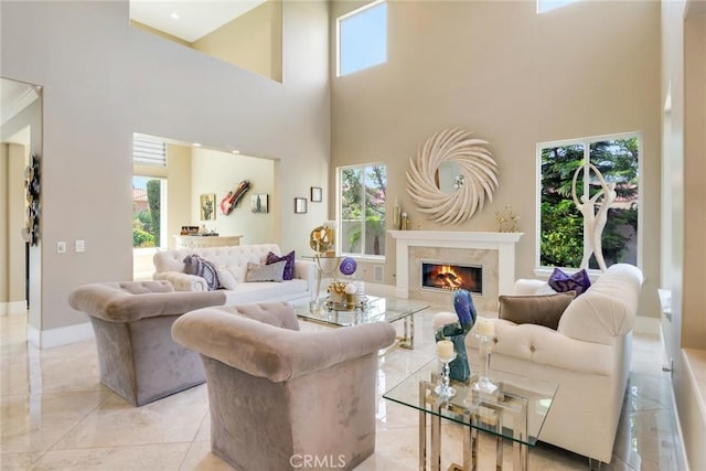 2155 Chandler Dr, Tustin, CA 92782 - living area featuring plenty of natural light, a high ceiling, a fireplace, and light marble finish flooring
