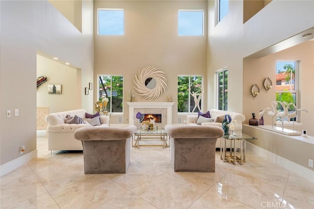 2155 Chandler Dr, Tustin, CA 92782 - living area featuring a high ceiling, marble tiled floors, and a high end fireplace