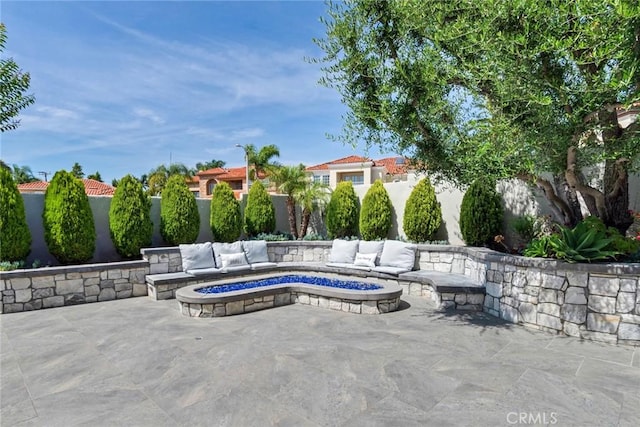 2155 Chandler Dr, Tustin, CA 92782 - fenced backyard featuring a patio area and an outdoor living space with a fire pit