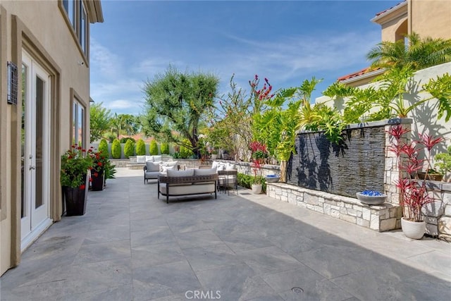 2155 Chandler Dr, Tustin, CA 92782 - view of patio / terrace featuring an outdoor living space and french doors