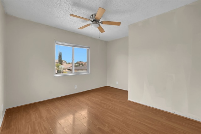 112 E Central Ave, San Gabriel, CA 91776 - spare room with wood finished floors, ceiling fan, and a textured ceiling