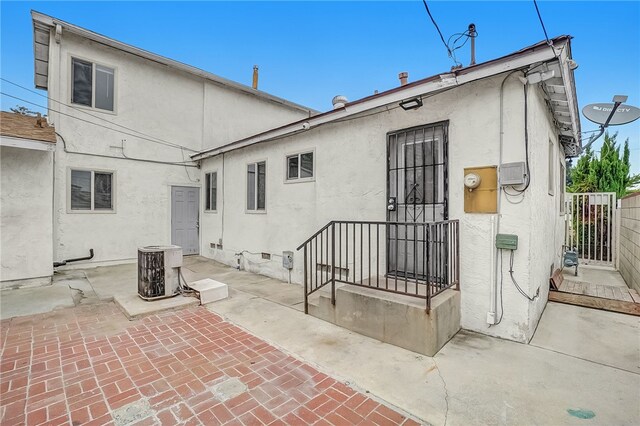 112 E Central Ave, San Gabriel, CA 91776 - rear view of house featuring stucco siding and a patio area
