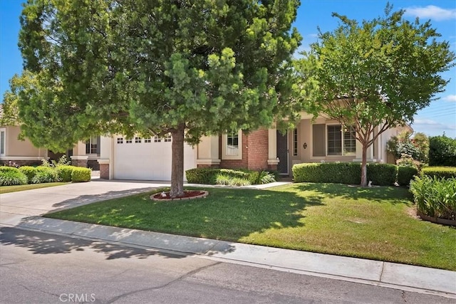 875 Eastlake Rd, Beaumont, CA 92223 - obstructed view of property with driveway, a garage, brick siding, a front lawn, and stucco siding
