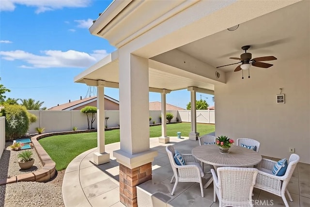 875 Eastlake Rd, Beaumont, CA 92223 - fenced backyard featuring a patio, ceiling fan, and outdoor dining area