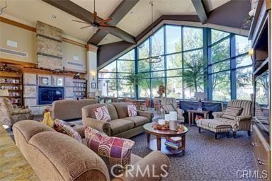 875 Eastlake Rd, Beaumont, CA 92223 - living area with high vaulted ceiling, ceiling fan, beam ceiling, a sunroom, and healthy amount of natural light
