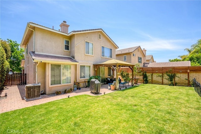 2635 Sunshine Valley Ct, Simi Valley, CA 93063 - back of property featuring a gazebo, stucco siding, a patio area, and a fenced backyard