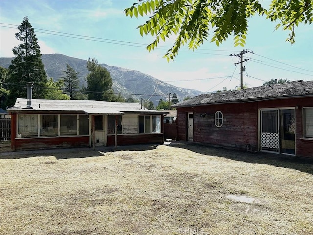 13923 Meadow Ln, Lytle Creek, CA 92358 - rear view of house with a mountain view and a sunroom