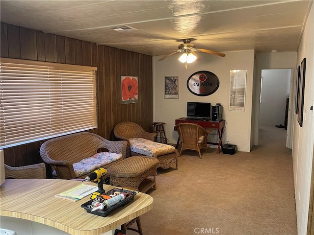 3236 Partridge Ln, Paso Robles, CA 93446 - living room featuring light carpet, ceiling fan, and wooden walls