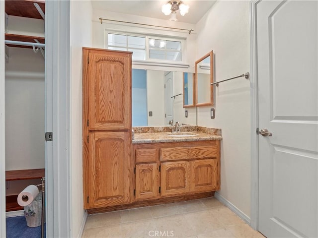 22905 Las Mananitas Dr, Valencia, CA 91354 - bathroom featuring vanity and tile patterned flooring