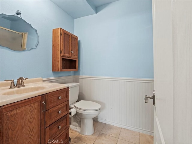 22905 Las Mananitas Dr, Valencia, CA 91354 - bathroom with vanity, wainscoting, and tile patterned flooring